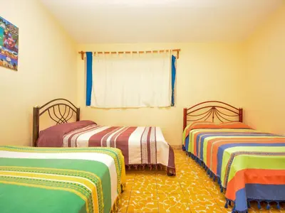 Cama o camas de una habitación en Los Nardos Hostel -pet friendly-