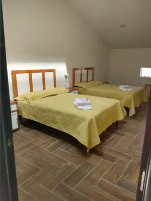 Cama o camas de una habitación en Hotel del Rosario