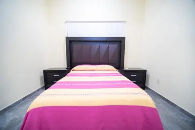 Cama o camas de una habitación en Casa nueva y moderna en Juchitán