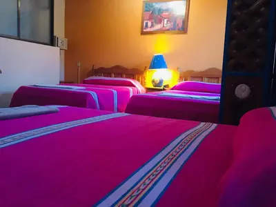 Cama o camas de una habitación en Hotel Cazomalli Oaxaca