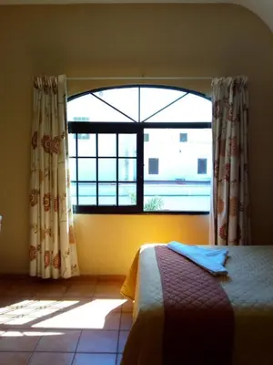 Cama o camas de una habitación en Hotel Virreynal