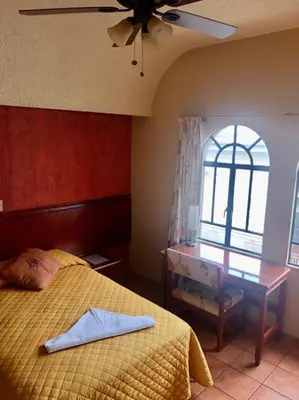 Cama o camas de una habitación en Hotel Virreynal
