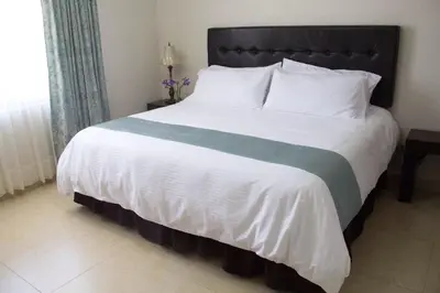 Cama o camas de una habitación en Hotel Nube Nueve