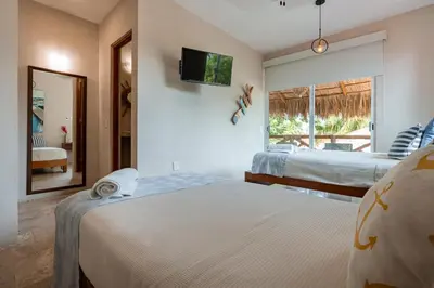 Cama o camas de una habitación en Rojo Manglar Acapulco