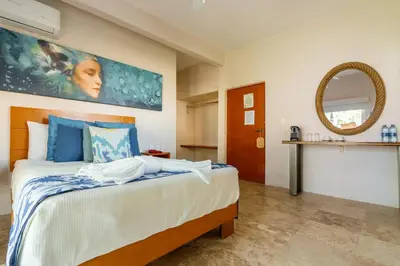 Cama o camas de una habitación en Rojo Manglar Acapulco