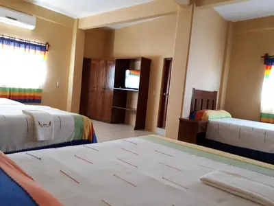 Cama o camas de una habitación en Hotel Alebrijes