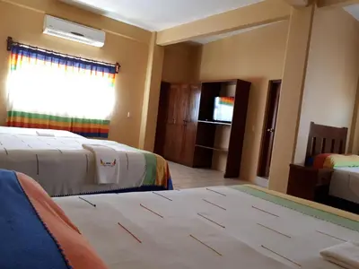 Cama o camas de una habitación en Hotel Alebrijes