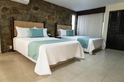 Cama o camas de una habitación en Mirador Acapulco