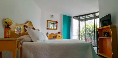 Cama o camas de una habitación en HOTEL EL PAN NUESTRO