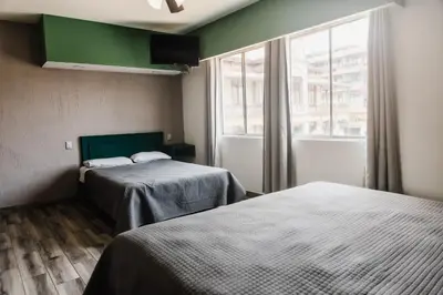 Cama o camas de una habitación en HOTEL PLAZA PALACIO