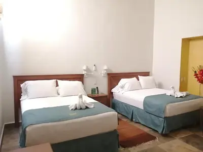 Cama o camas de una habitación en Casa Esmeralda Hotel