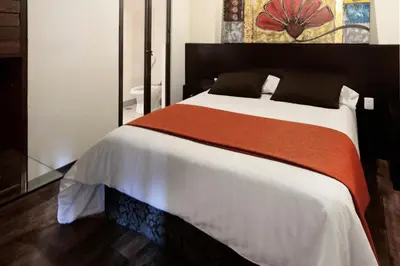 Cama o camas de una habitación en Aztic Hotel and Executive Suites