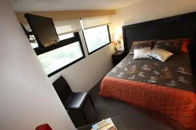 Cama o camas de una habitación en Aztic Hotel and Executive Suites