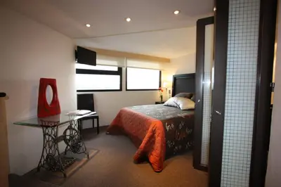 Cama o camas de una habitación en Aztic Hotel and Executive Suites