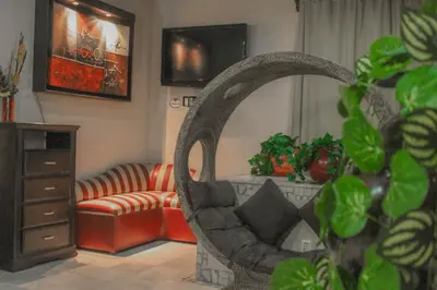 Una televisión o centro de entretenimiento en Villas y Suites Paraiso del Sur