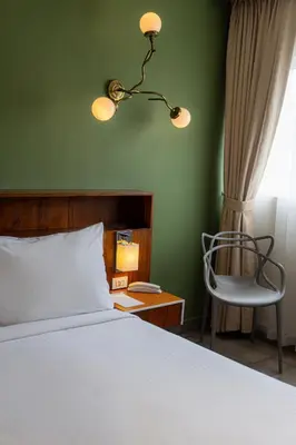 Cama o camas de una habitación en Flor de Mayo Hotel & Restaurant