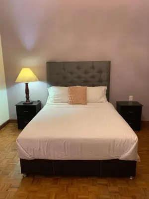 Cama o camas de una habitación en Alma mía - Hospedaje Cholula