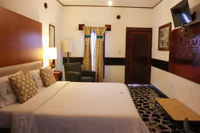 Cama o camas de una habitación en Hotel Vitorina Cholula