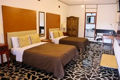 Cama o camas de una habitación en Hotel Vitorina Cholula