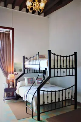 Cama o camas de una habitación en Quinta Alhóndiga Galindo Hotel Boutique