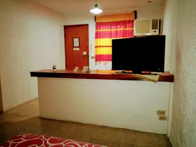 Una televisión o centro de entretenimiento en Hotel Calendas