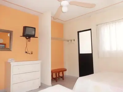 Cama o camas de una habitación en Suites Angelopolis