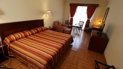 Cama o camas de una habitación en Hotel Casa Real Tehuacan