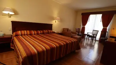 Cama o camas de una habitación en Hotel Casa Real Tehuacan