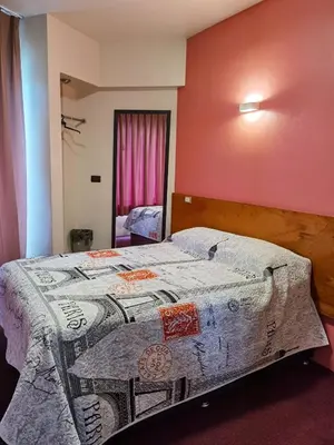 Cama o camas de una habitación en Hotel Edén