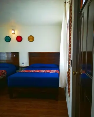 Cama o camas de una habitación en Hotel Tlatoani