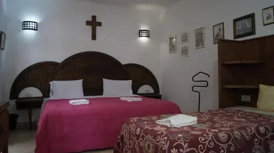 Cama o camas de una habitación en Hotel Hacienda Xico Inn