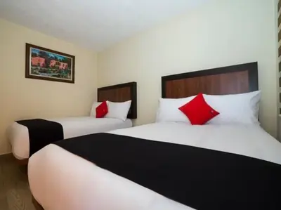 Cama o camas de una habitación en Hotel Colonial Acopinalco Inn