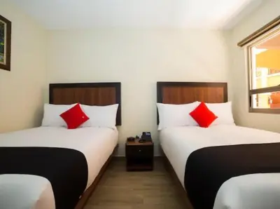 Cama o camas de una habitación en Hotel Colonial Acopinalco Inn
