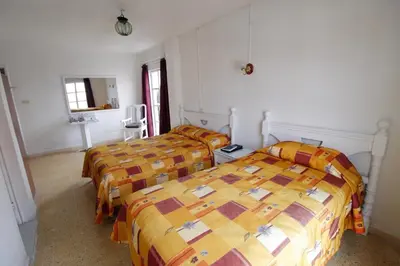 Cama o camas de una habitación en Hotel Castillo