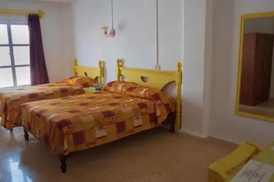 Cama o camas de una habitación en Hotel Castillo