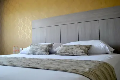 Cama o camas de una habitación en Hotel Infinity