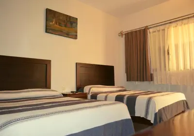 Cama o camas de una habitación en Hotel Don Nino