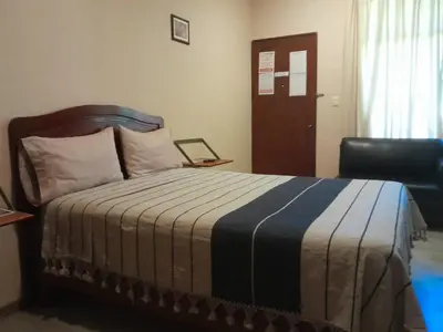 Cama o camas de una habitación en Hotel Don Nino