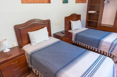 Cama o camas de una habitación en Hotel Don Nino