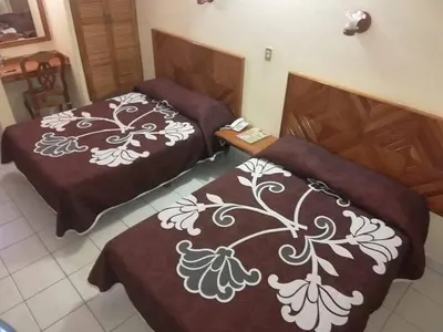 Cama o camas de una habitación en Hotel Citlalli Xalapa