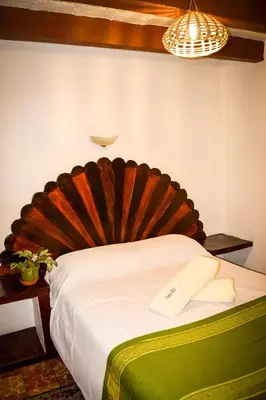 Cama o camas de una habitación en Hotel Posada Santa Anita