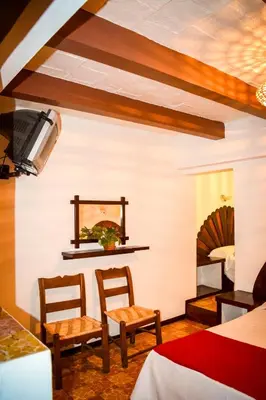 Una televisión o centro de entretenimiento en Hotel Posada Santa Anita
