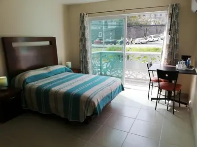 Cama o camas de una habitación en CORDIALITY INN