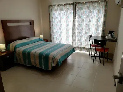 Cama o camas de una habitación en CORDIALITY INN