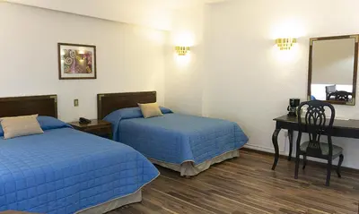 Cama o camas de una habitación en Hotel Palacio