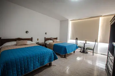 Cama o camas de una habitación en Hotel Palacio