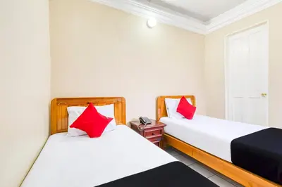 Cama o camas de una habitación en Capital O Colina Dorada