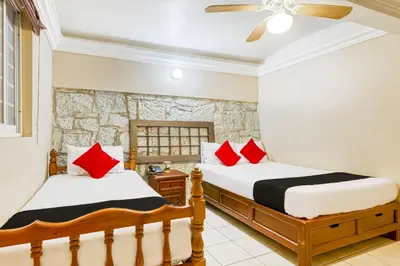 Cama o camas de una habitación en Capital O Colina Dorada