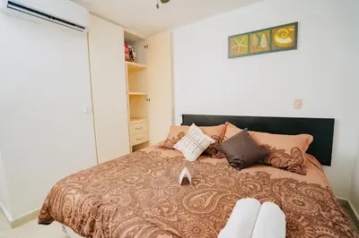 Cama o camas de una habitación en DEPA 100 POR CIENTO FAMILIAR ACAPULCO CERCA DEL MAR CON ROFF GARDEN y JACUZZI