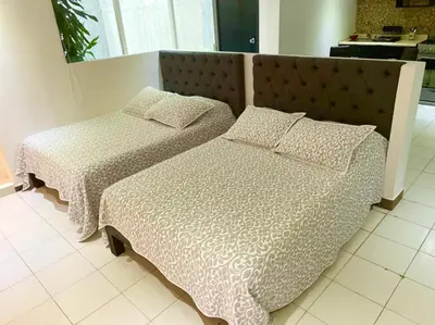 Cama o camas de una habitación en Acapulco suites Y condominio Mediterrane